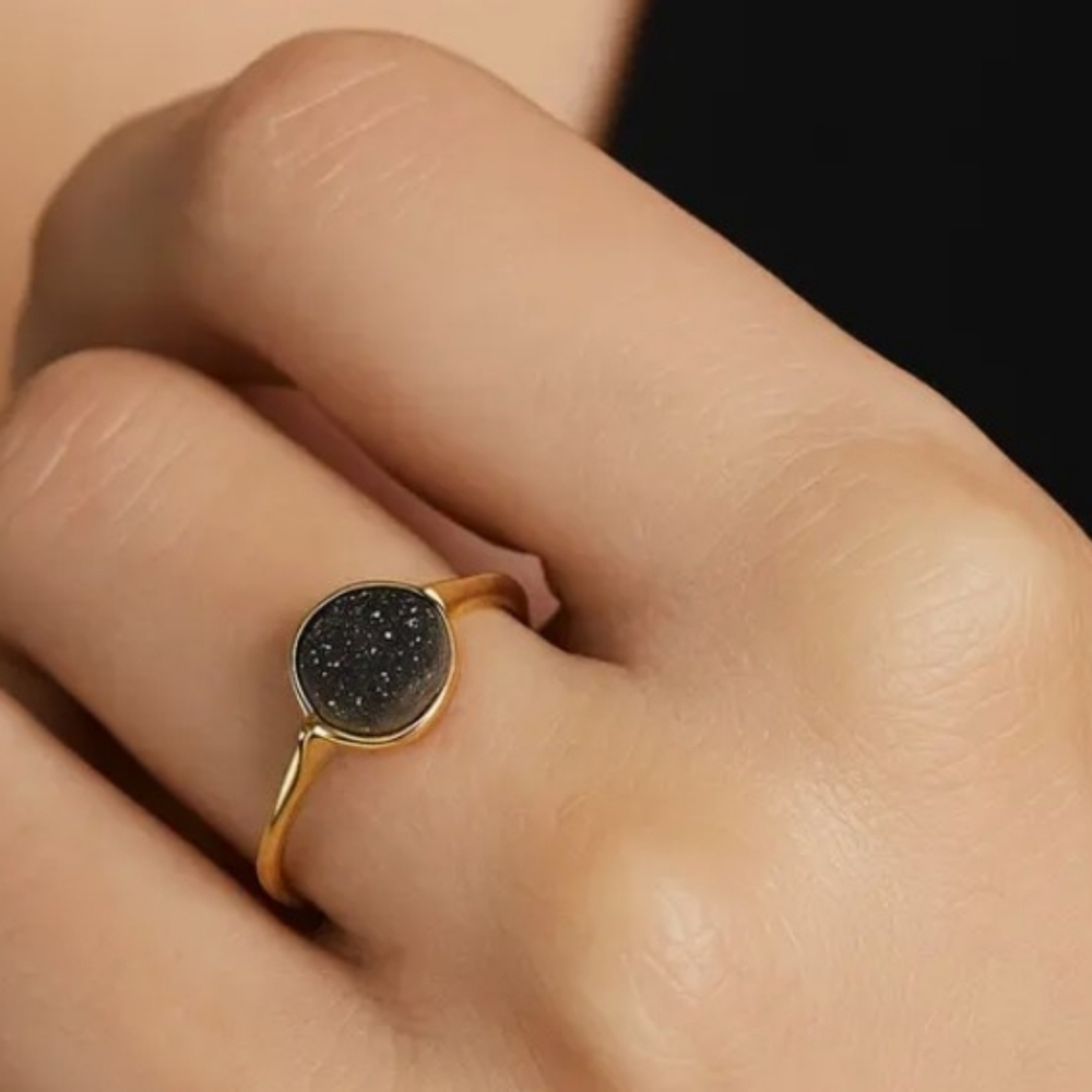 Elegant Gold and Black Ring